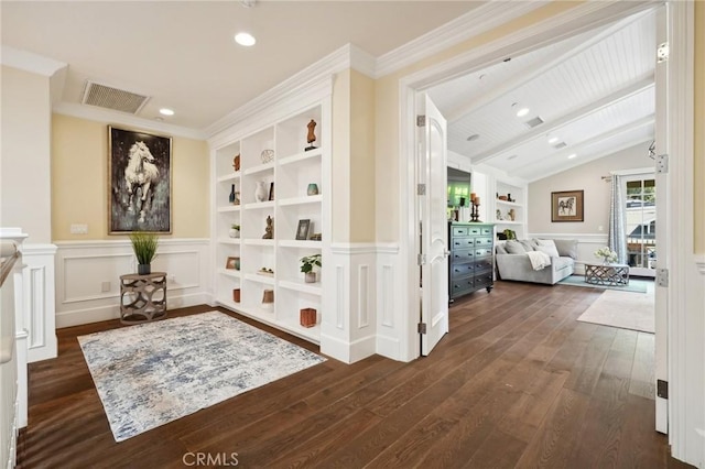 hall featuring ornamental molding, built in shelves, dark hardwood / wood-style flooring, and lofted ceiling with beams