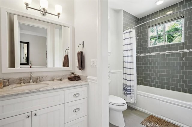 full bathroom featuring tile patterned floors, toilet, vanity, and shower / bath combo