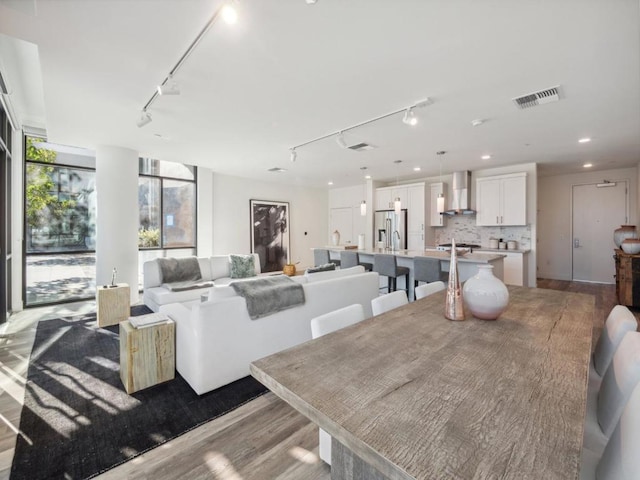 dining room with light hardwood / wood-style flooring