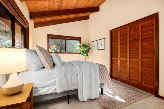 carpeted bedroom featuring lofted ceiling with beams and wooden ceiling