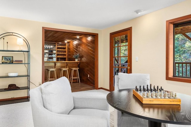 living area with plenty of natural light and bar area