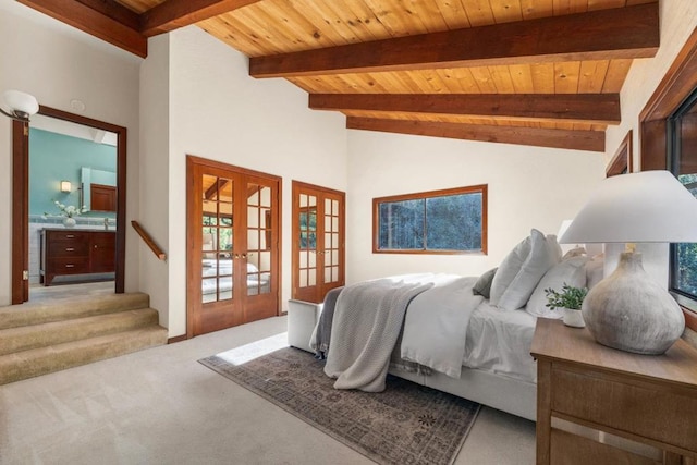 carpeted bedroom with wood ceiling, french doors, and beamed ceiling