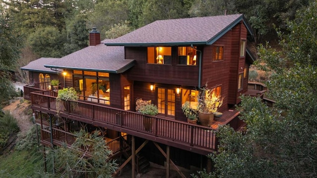 rear view of house featuring a deck