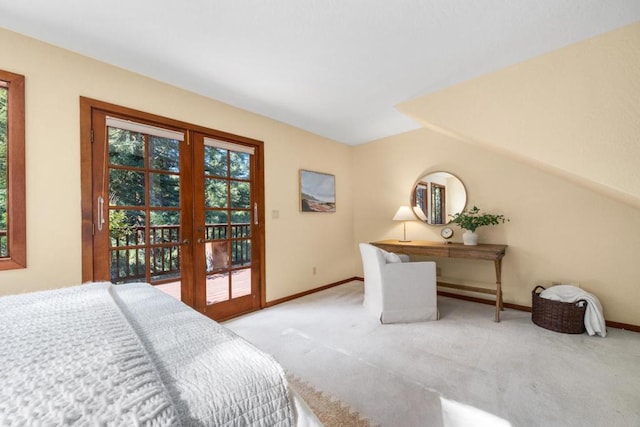 carpeted bedroom with lofted ceiling, access to exterior, and french doors