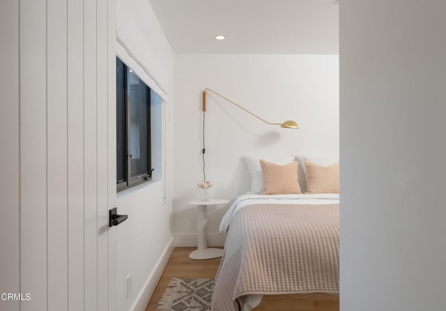 bedroom featuring wood-type flooring