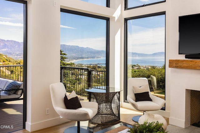 sunroom featuring a mountain view