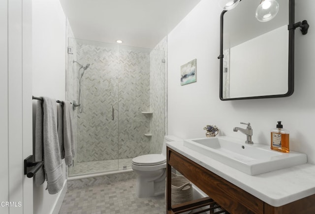 bathroom with vanity, toilet, and an enclosed shower