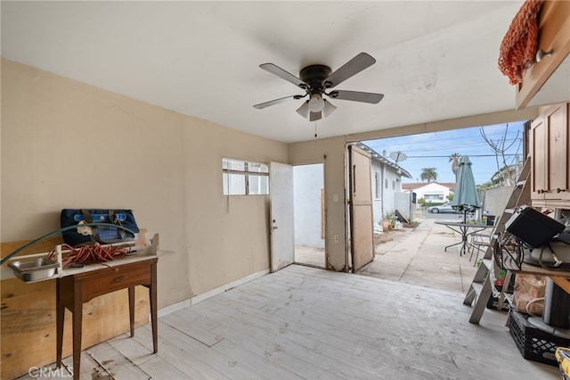 interior space with ceiling fan and light hardwood / wood-style floors