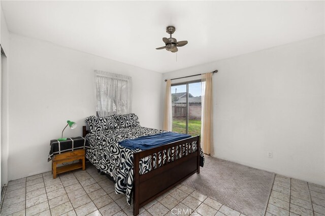 bedroom featuring ceiling fan and access to outside