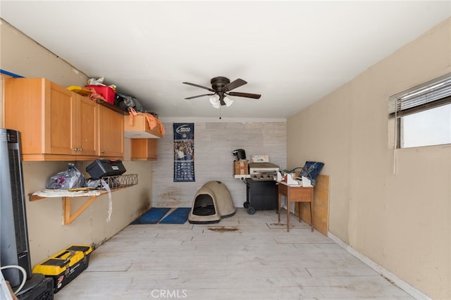 interior space with ceiling fan and light wood-type flooring