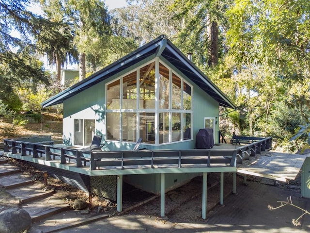 rear view of property with a deck