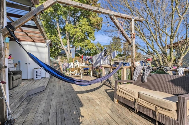 deck featuring outdoor lounge area