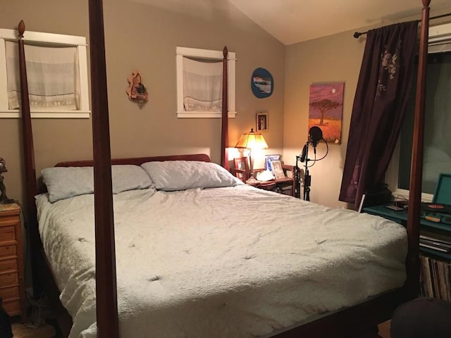 bedroom featuring lofted ceiling