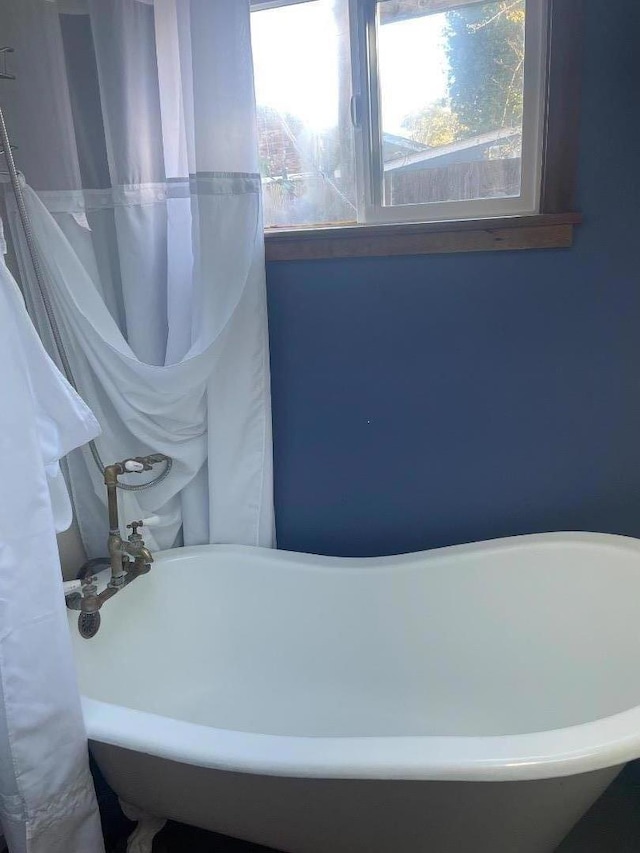 bathroom with a washtub