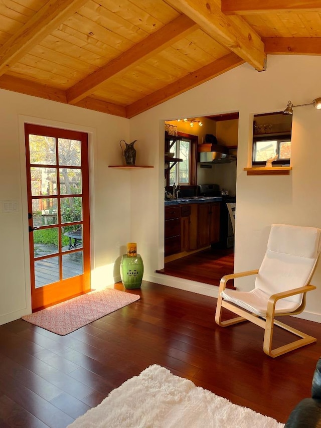 sitting room featuring lofted ceiling with beams, wooden ceiling, and dark hardwood / wood-style flooring