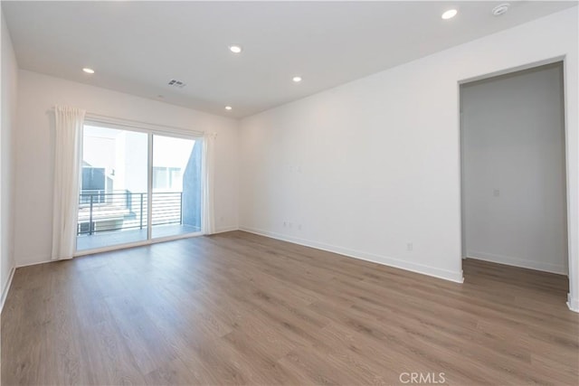 empty room with light hardwood / wood-style floors