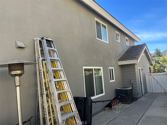 view of home's exterior featuring a patio and central air condition unit