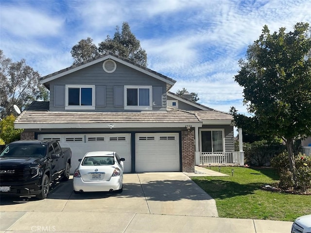 view of front of property featuring a garage and a front yard