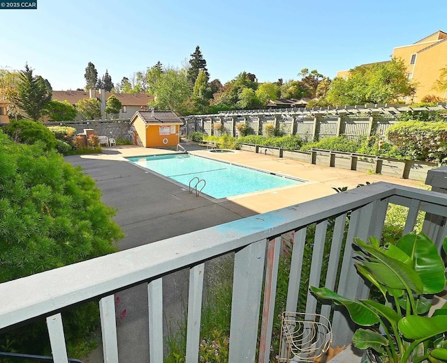 view of swimming pool with a patio area