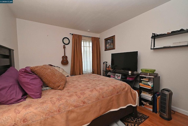 bedroom featuring wood-type flooring