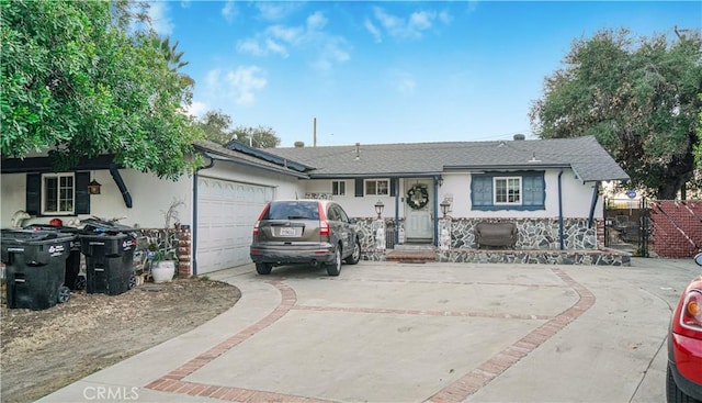 ranch-style home featuring a garage