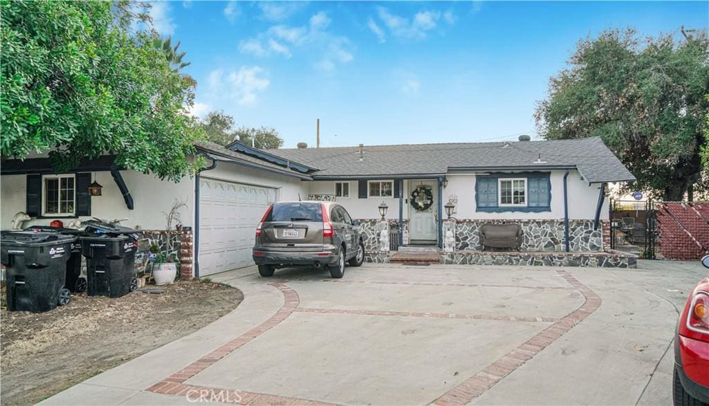 ranch-style home featuring a garage
