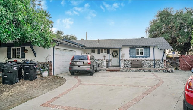 ranch-style home featuring a garage