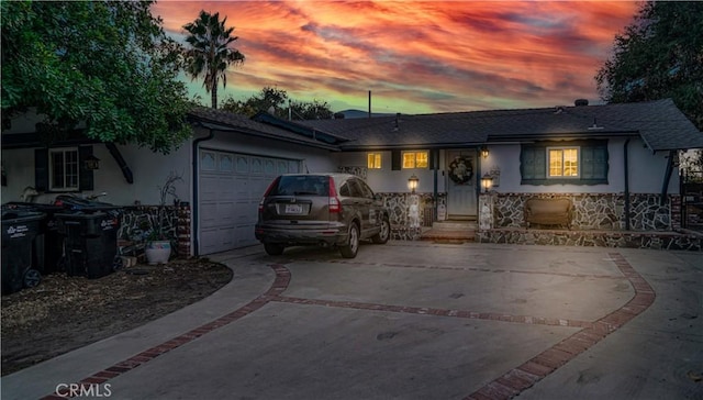 ranch-style house featuring a garage