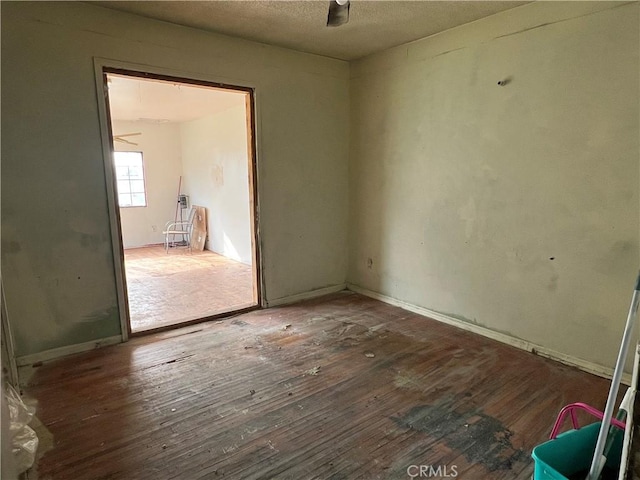 unfurnished room featuring hardwood / wood-style flooring and ceiling fan