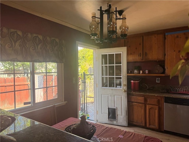 dining space featuring ornamental molding and a chandelier