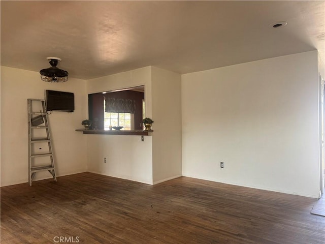 unfurnished room featuring dark hardwood / wood-style floors