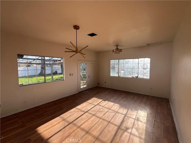 empty room with hardwood / wood-style floors