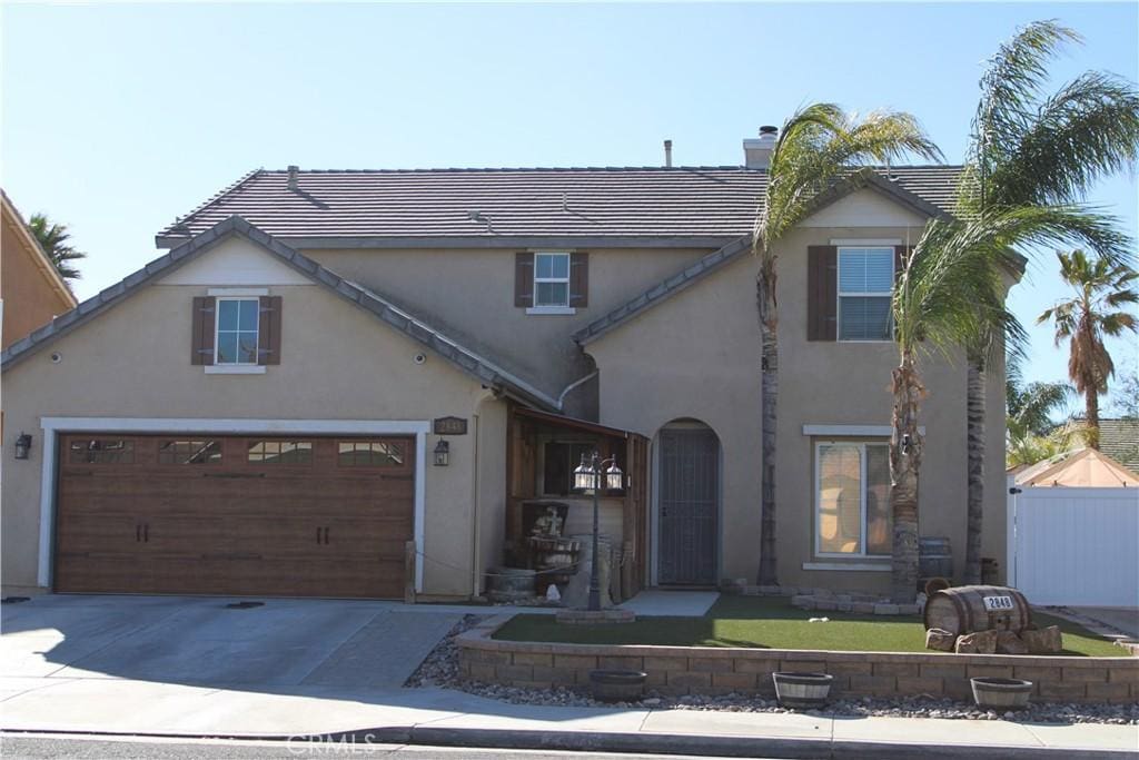 view of front of property featuring a garage