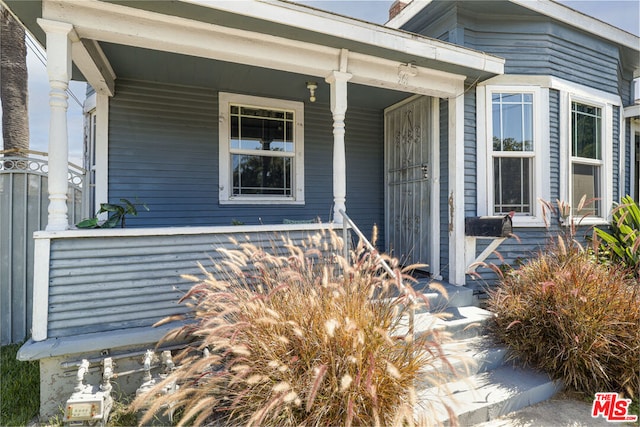 entrance to property with a porch