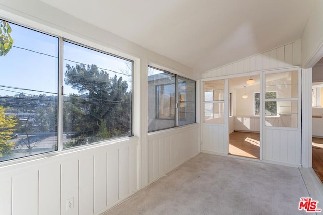 unfurnished sunroom with vaulted ceiling