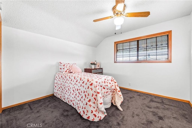 bedroom featuring ceiling fan, lofted ceiling, carpet floors, and a textured ceiling