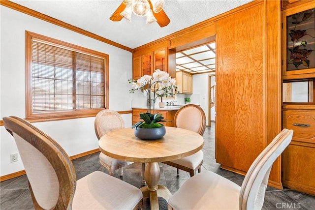 dining room featuring crown molding and ceiling fan