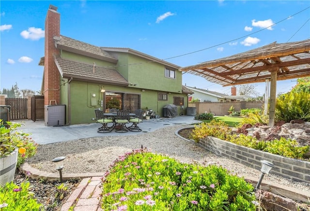 rear view of property with a patio area