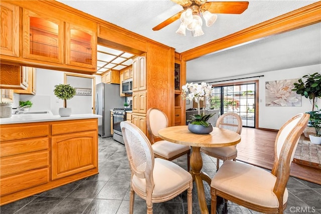 tiled dining room with ceiling fan