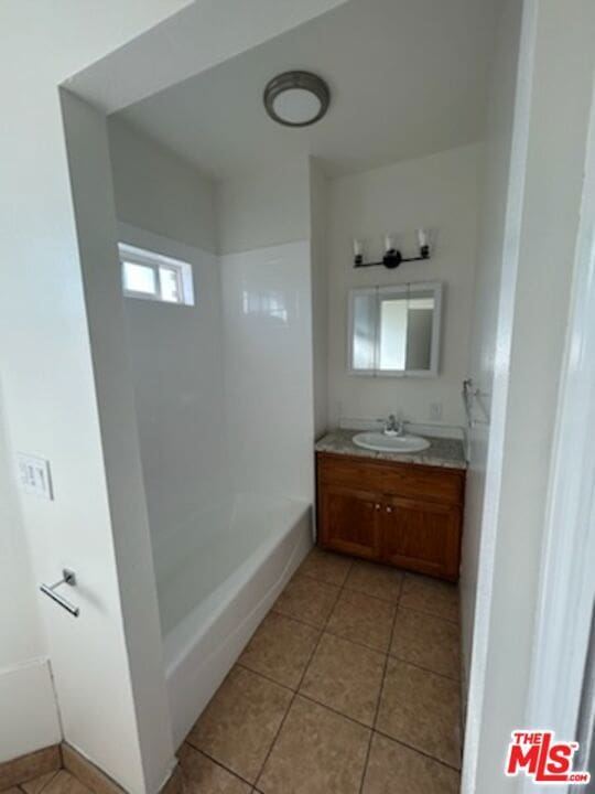 bathroom with vanity and tile patterned flooring