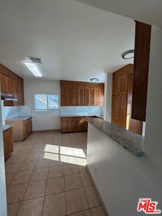 kitchen with light tile patterned floors