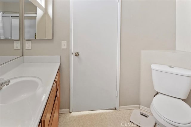 bathroom with toilet and vanity