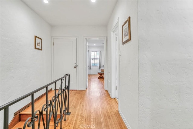 hallway with light wood-type flooring