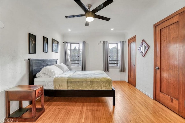 bedroom featuring ceiling fan and light hardwood / wood-style flooring