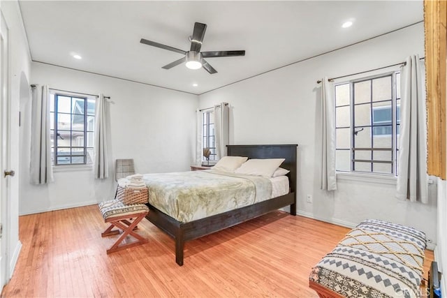 bedroom featuring ceiling fan and light hardwood / wood-style flooring