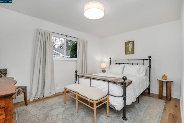 bedroom featuring hardwood / wood-style flooring