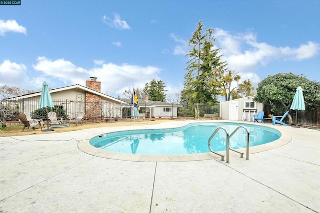 view of swimming pool featuring a patio area