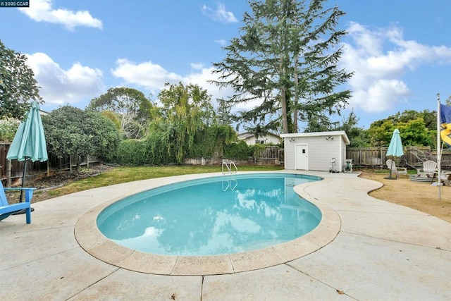 view of swimming pool with a patio and an outdoor structure