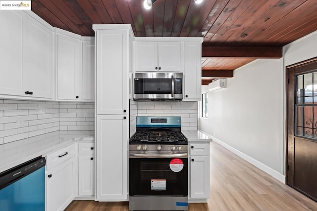 kitchen featuring beam ceiling, decorative backsplash, stainless steel appliances, white cabinets, and light stone counters