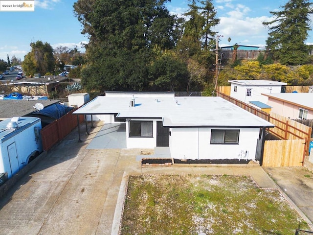 exterior space with a carport